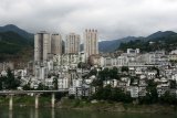 A typical Chinese city in central China. Blocks of flats and mountains all around…