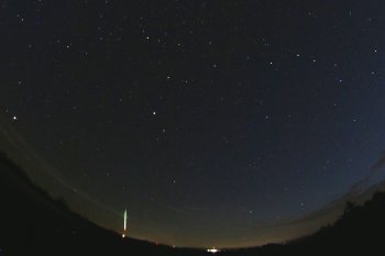 Figure 1. Part of the all-sky image showing the fireball of July 10, 2018 obtained by the automatic digital all-sky fireball camera at the Czech station Přimda. The bolide is very low above the western horizon. (photo: Astronomical Institute of the CAS). Figure 1. Part of the all-sky image showing the fireball of July 10, 2018 obtained by the automatic digital all-sky fireball camera at the Czech station Přimda. The bolide is very low above the western horizon. (photo: Astronomical Institute of the CAS).