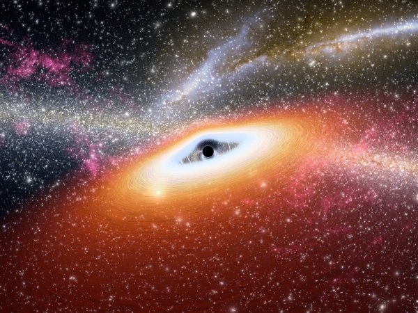 Malířova představa černé díry obklopené akrečním diskem. (c) NASA/JPL-Caltech