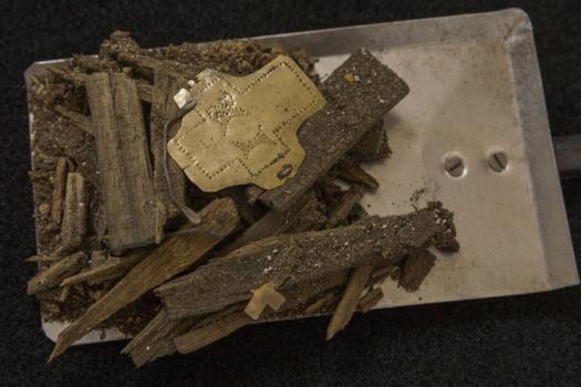 Parts of the wooden box relic with a golden plate