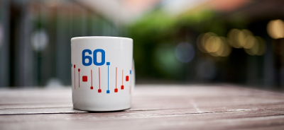 A gift mug for the 60th anniversary of the IMG, which was received by all employees