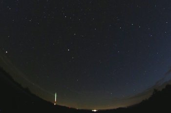 Figure 1. Part of the all-sky image showing the fireball of July 10, 2018 obtained by the automatic digital all-sky fireball camera at the Czech station Přimda. The bolide is very low above the western horizon. (photo: Astronomical Institute of the CAS).