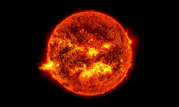 The bright light of a solar flare on the left side of the Sun. Credit: NASA/SDO