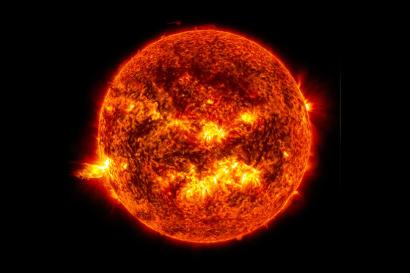The bright light of a solar flare on the left side of the Sun. Credit: NASA/SDO