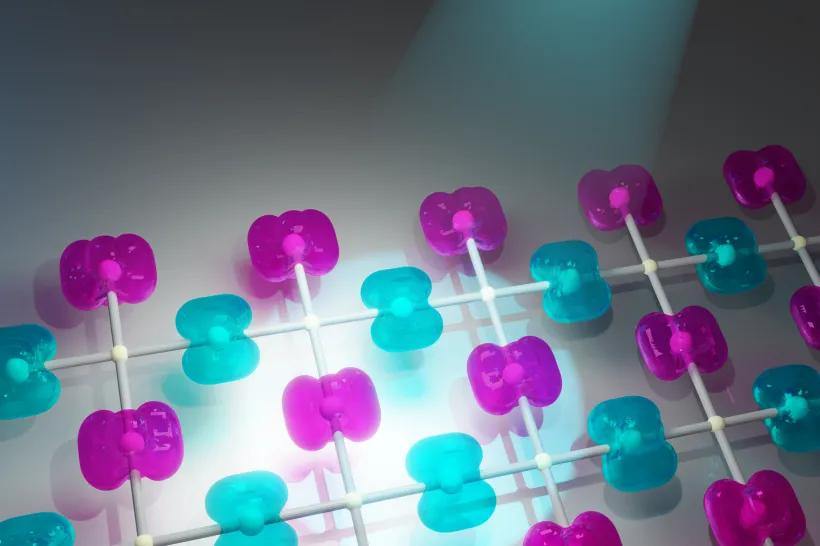 ​​​​​​​In altermagnets on adjacent magnetic atoms, not only the directions of spin polarization alternate (shown in purple and blue), but also the shapes of the atoms themselves (shown by the tilt of the electron densities in two different directions). The blue beam shows a photoemission experiment on a synchrotron that was used to demonstrate altermagnetism.