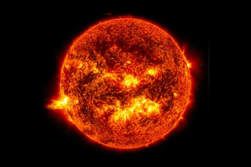 The bright light of a solar flare on the left side of the Sun. Credit: NASA/SDO